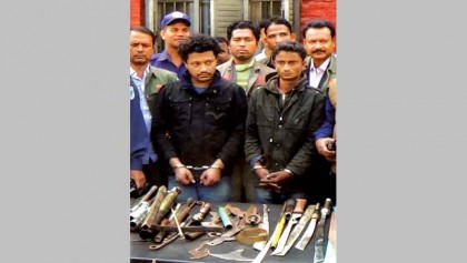 2 held with arms from newspaper office