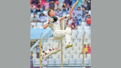 Warner happy to hit a ton
in a challenging situation