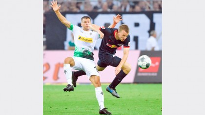 Werner hat-trick fires Leipzig to top