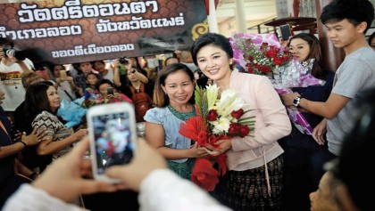 Thai ex-PM Yingluck defies army with selfie and smiles tour