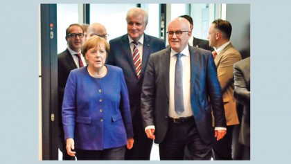 Germany coalition talks begin after bruising election result for Merkel