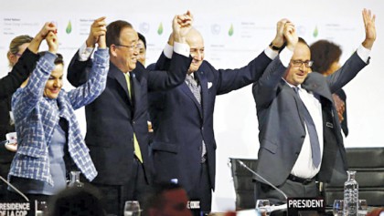 Nearly 200 nations adopt climate agreement at COP21 talks in Paris