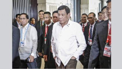 After the slur and snub — finally a handshake between Obama and Philippines president