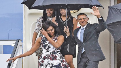 Rain, deserted streets, police greet Obama in Havana
