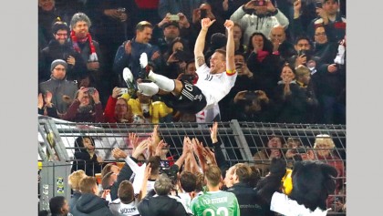 Podolski signs off Germany career in style