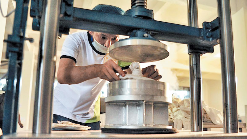 Making tea bricks in the 'City of Tea'