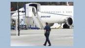 Boeing to take $4.9b charge over grounded jet