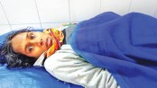 Ejected from hospital, woman bears child in open