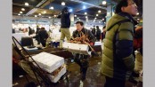 Loud, chaotic, historic Korean fish 
market resists gentrification