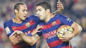 Suarez hattrick puts Barcelona level with Madrid
