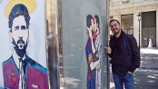 Messi, Ronaldo kissing graffiti 
