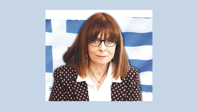 Greece hands reins to first woman president